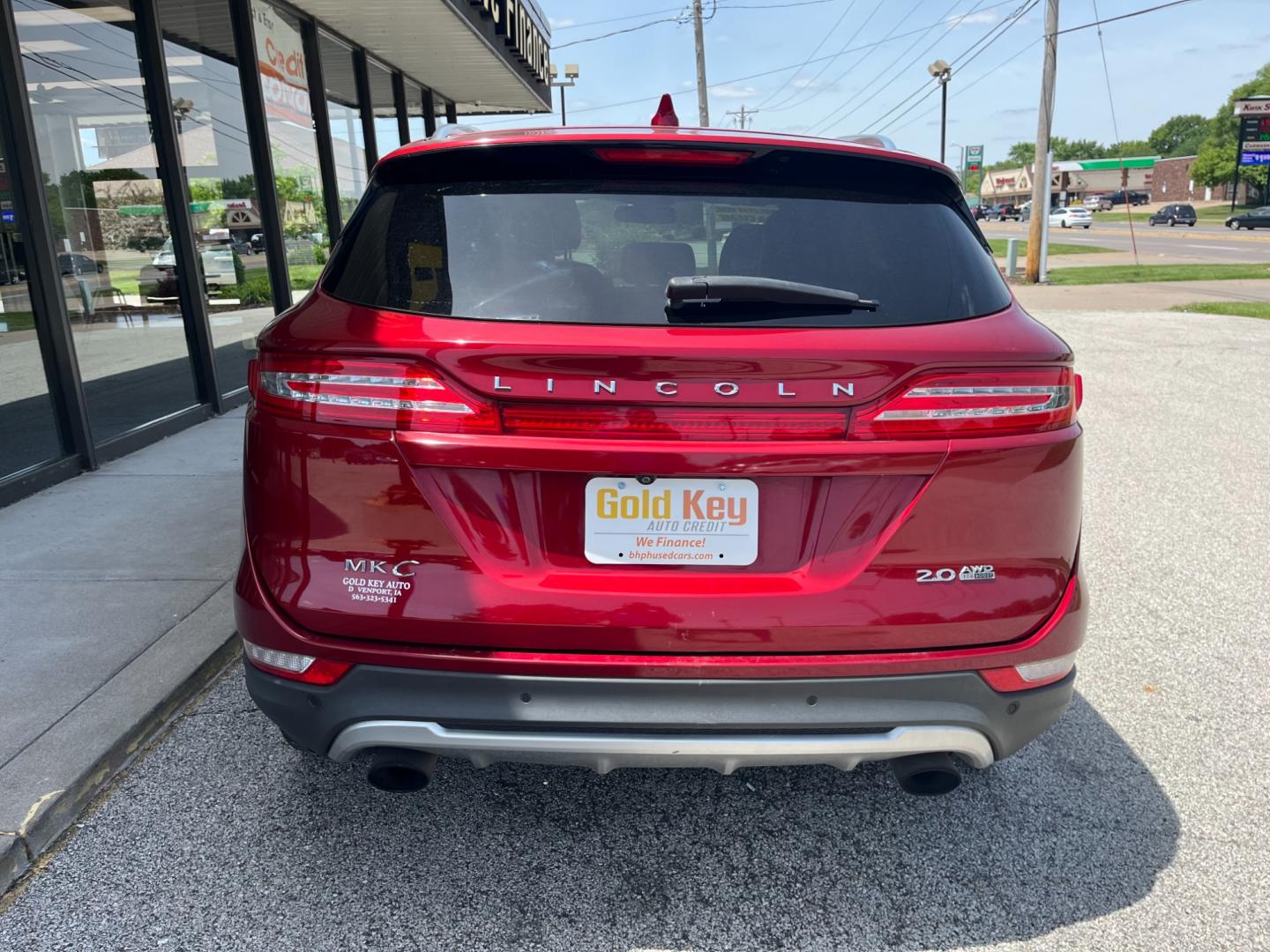 2015 Ruby Red Met Tinted CC Lincoln MKC AWD (5LMCJ2A92FU) with an 2.0L L4 DOHC 16V engine, 6-Speed Automatic transmission, located at 1633 W Kimberly, Davenport, IA, 52806, (563) 323-5341, 41.559456, -90.598732 - Photo#4